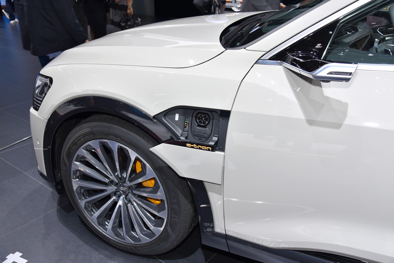 Electric charging port and alloy wheel design on vehicle front side