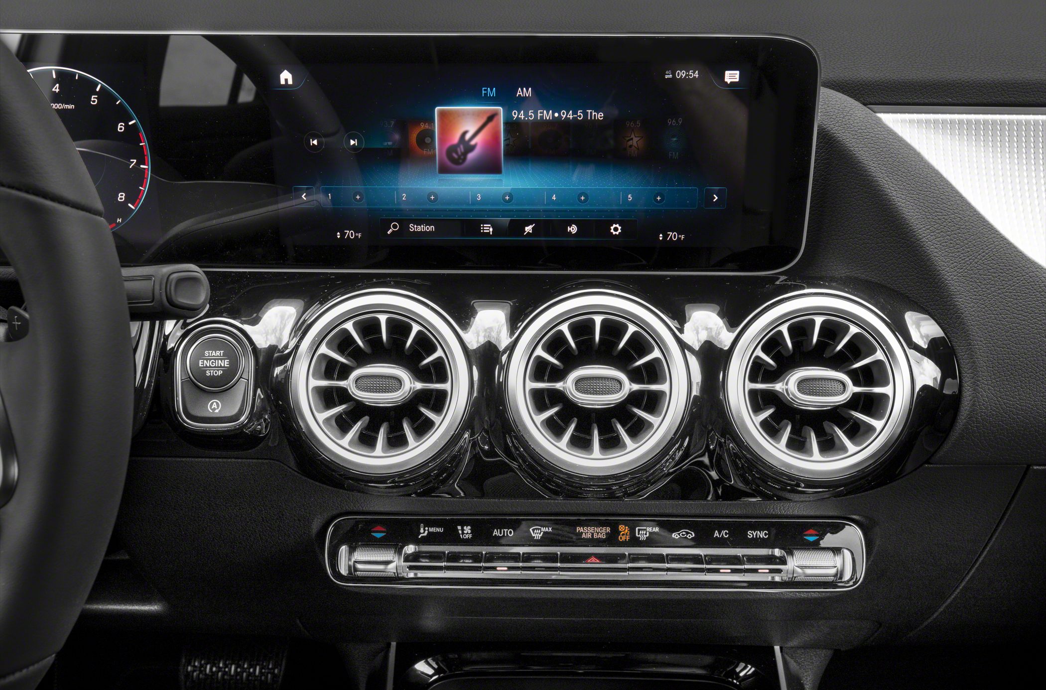 Three circular air vents and digital dashboard display panel