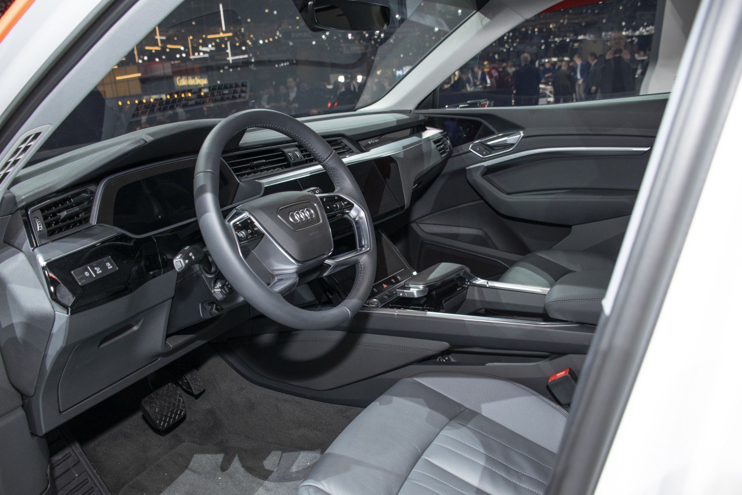 Modern electric SUV interior with digital dashboard and touchscreen controls