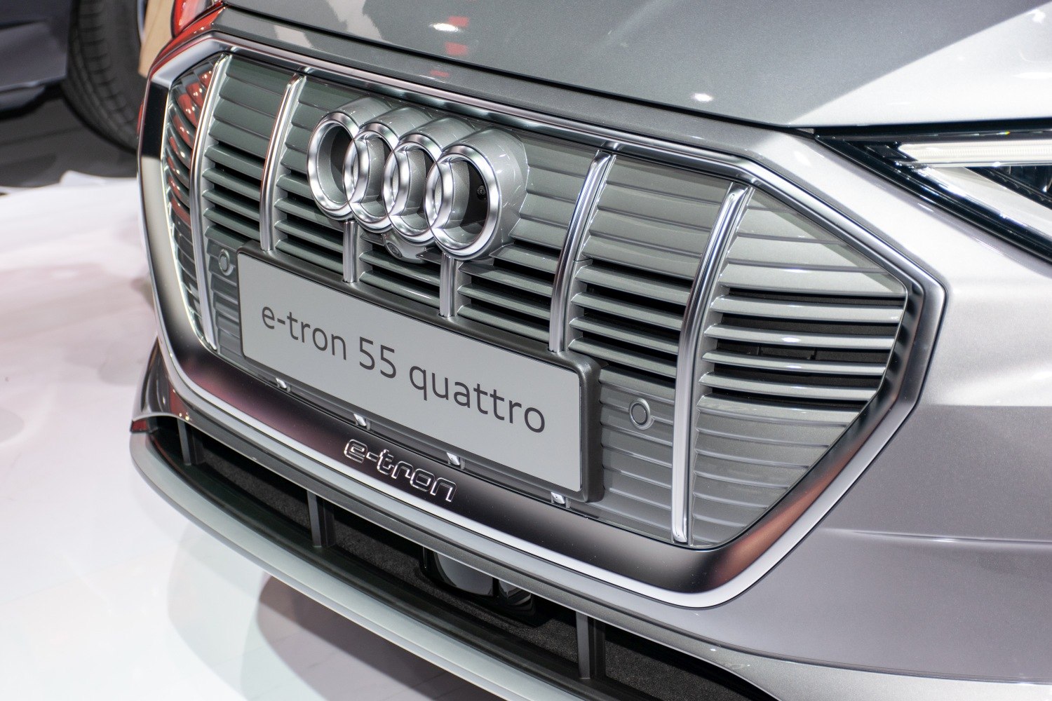 Close-up of front grille, Audi rings, and illuminated e-tron badge