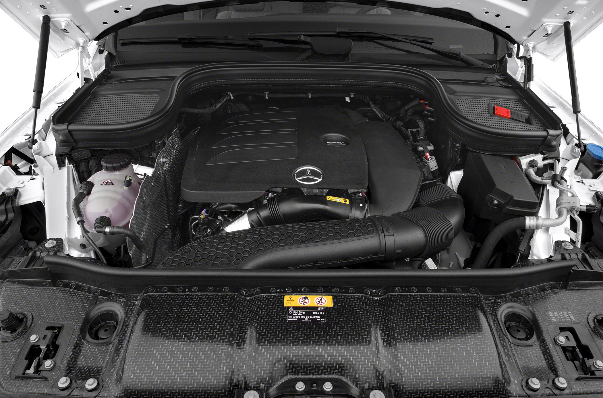 Close-up of engine bay with engine cover and fluid reservoirs