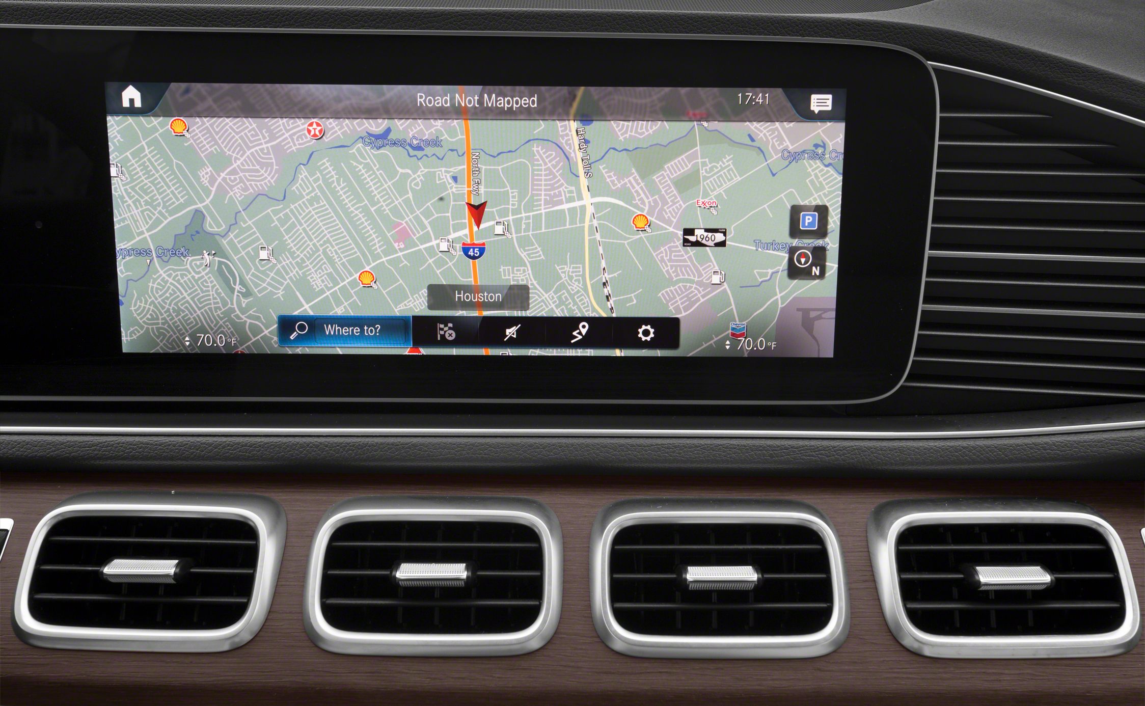 Large infotainment touchscreen with navigation and dashboard air vents