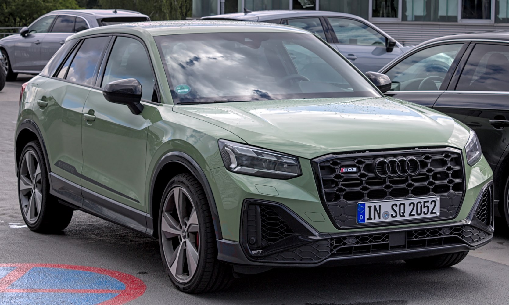 Front view of a compact SUV with honeycomb grille and LED headlights