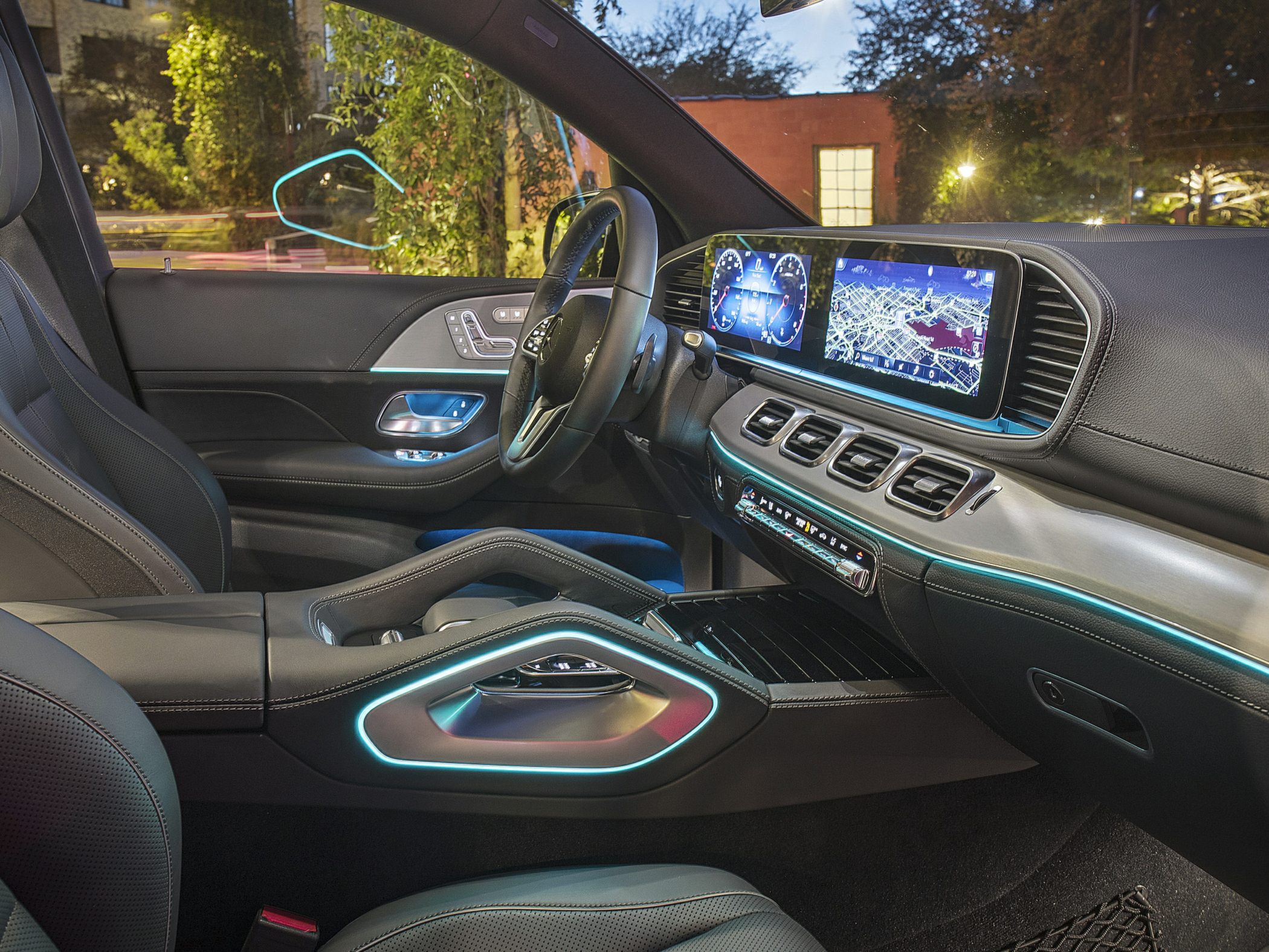 Modern digital dashboard and ambient lighting in luxury SUV interior