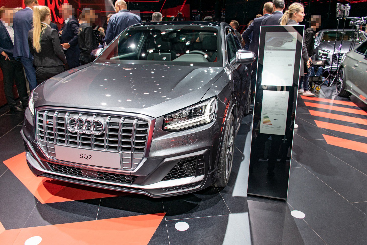 Front grille and LED headlight of a luxury compact SUV.