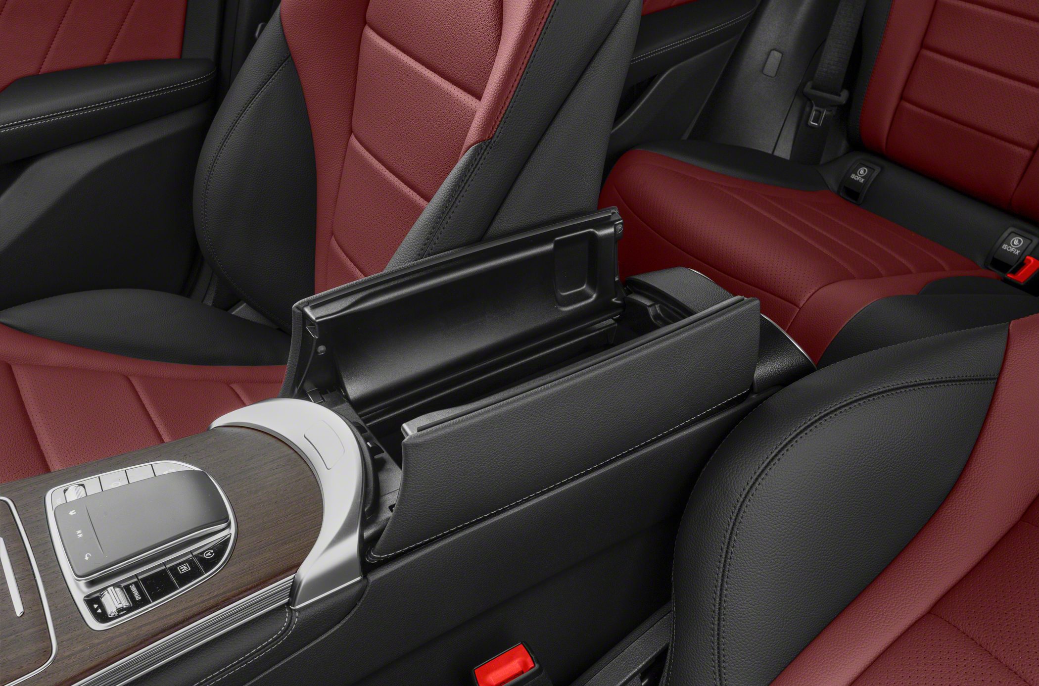Open center console armrest with red and black leather seats