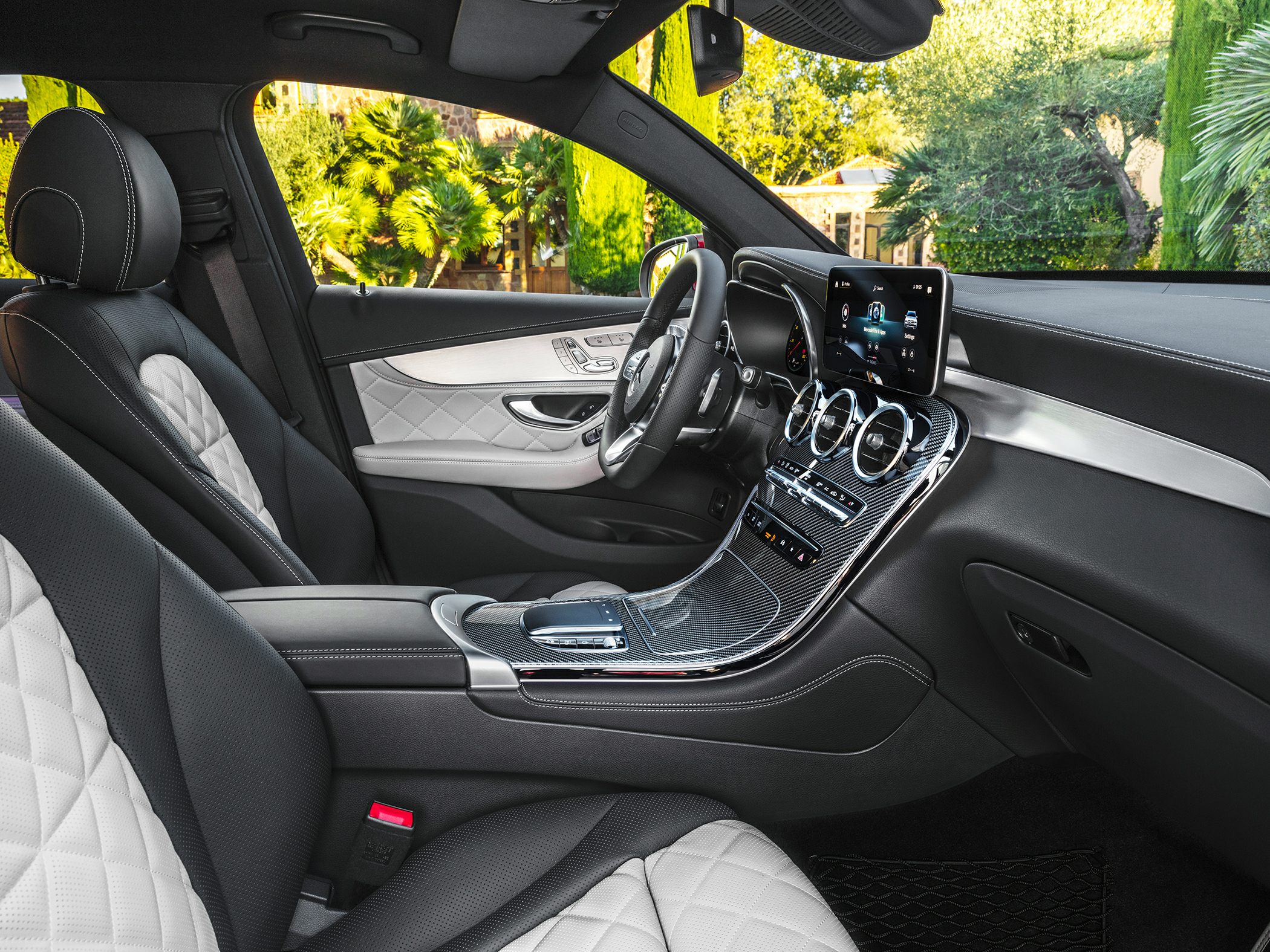 Quilted leather seats and advanced dashboard with touchscreen in premium SUV interior