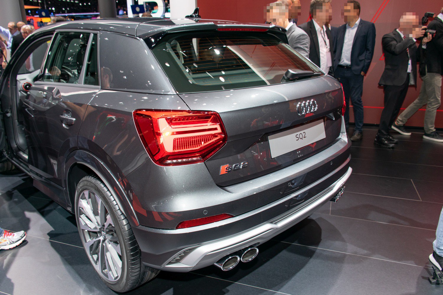 Rear view showing LED taillights, dual exhaust, and sporty rear bumper