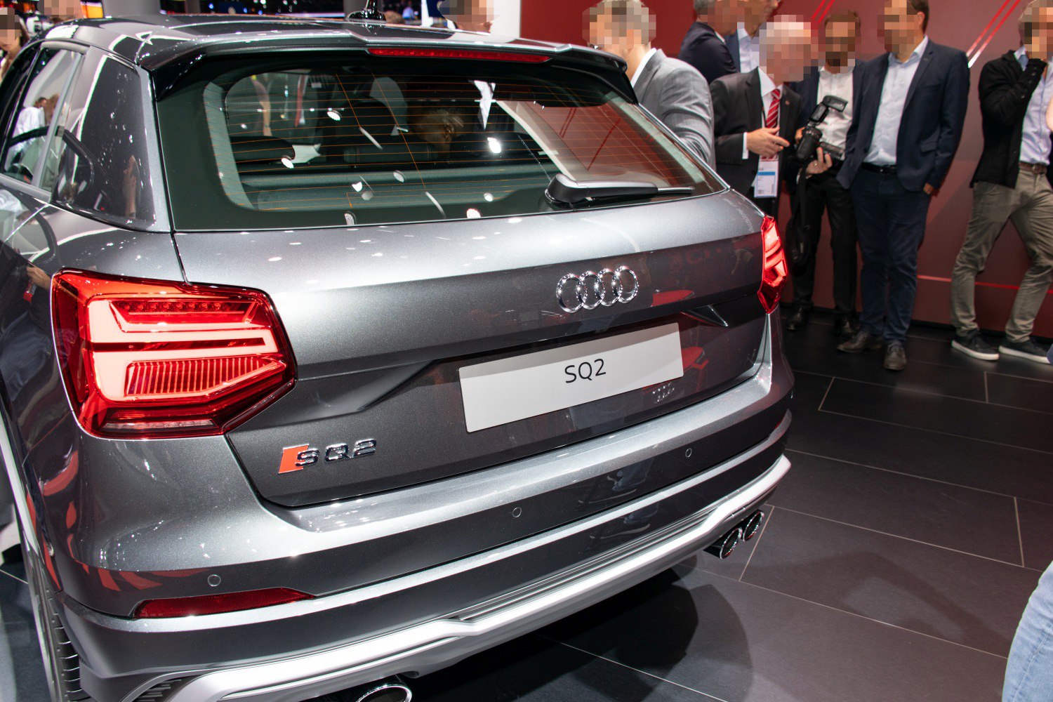 Rear view with distinctive tail lights and dual exhaust tips