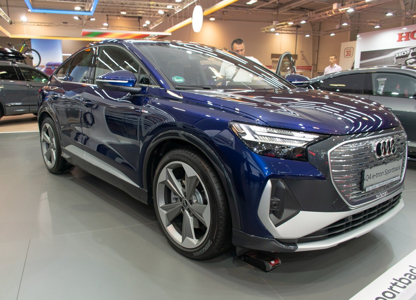 Electric SUV front side view with aerodynamic lines and LED headlights