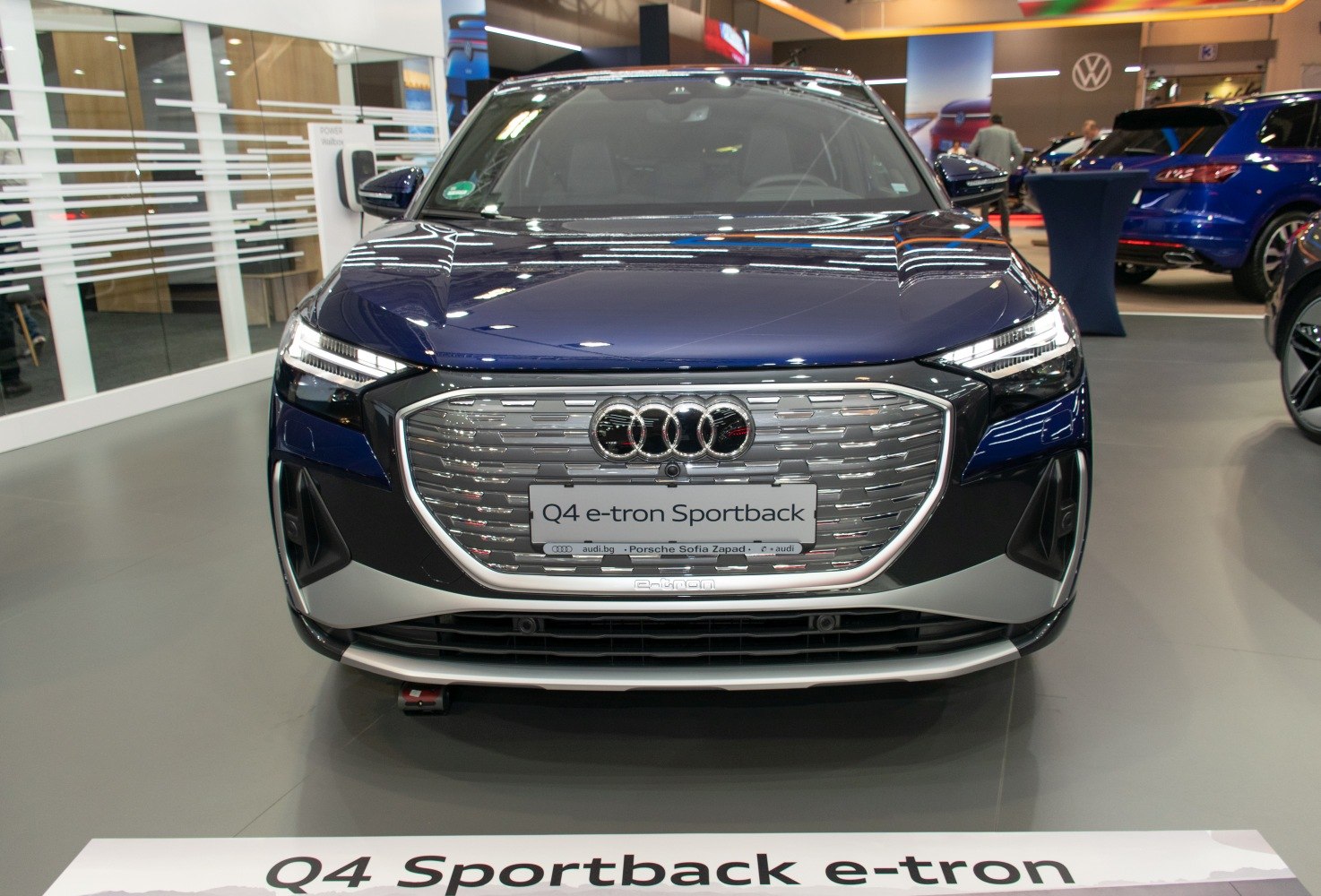 Front view of electric SUV with distinctive grille and LED headlights