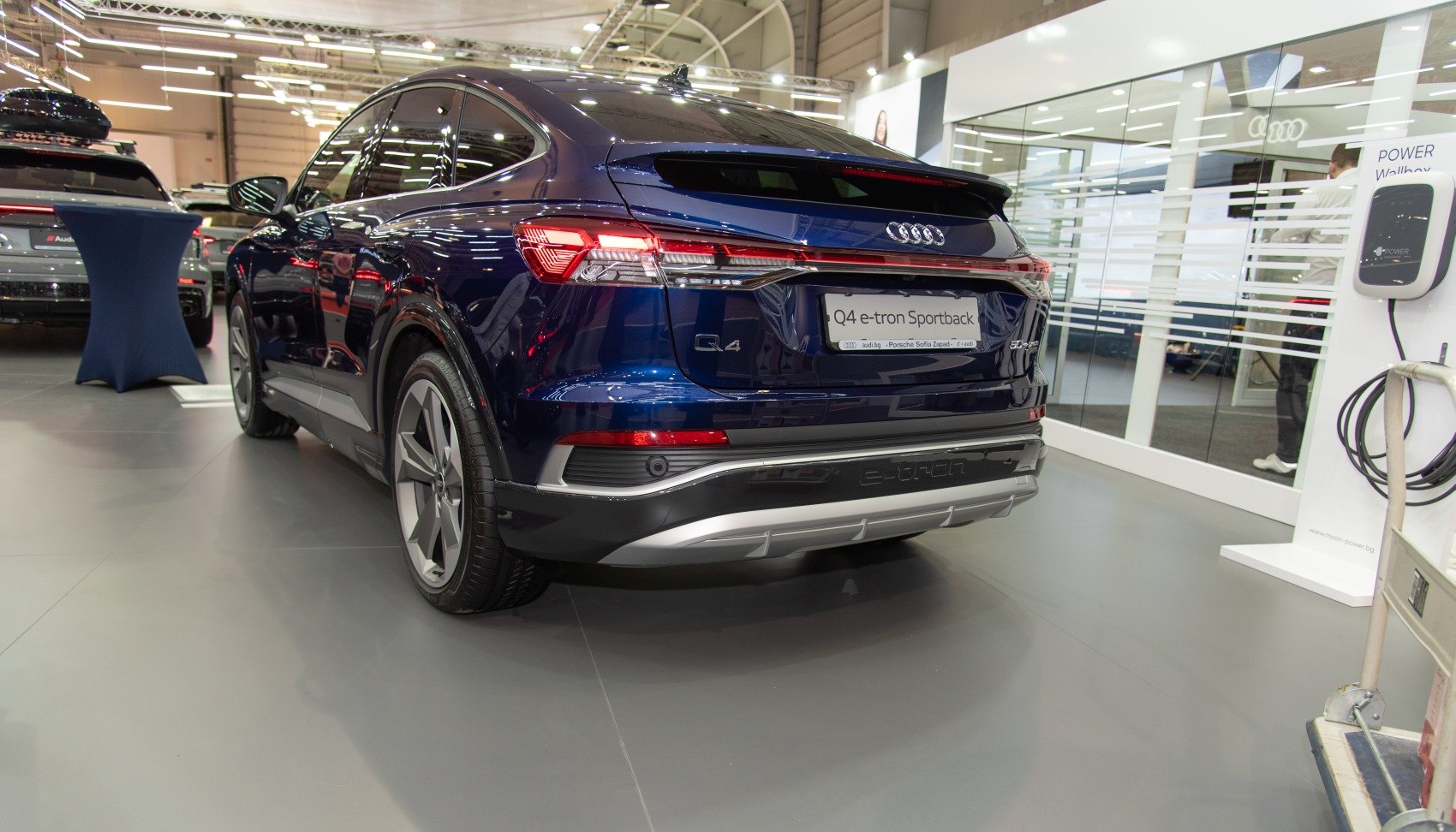Rear view of a modern electric SUV showcasing taillights and bumper design