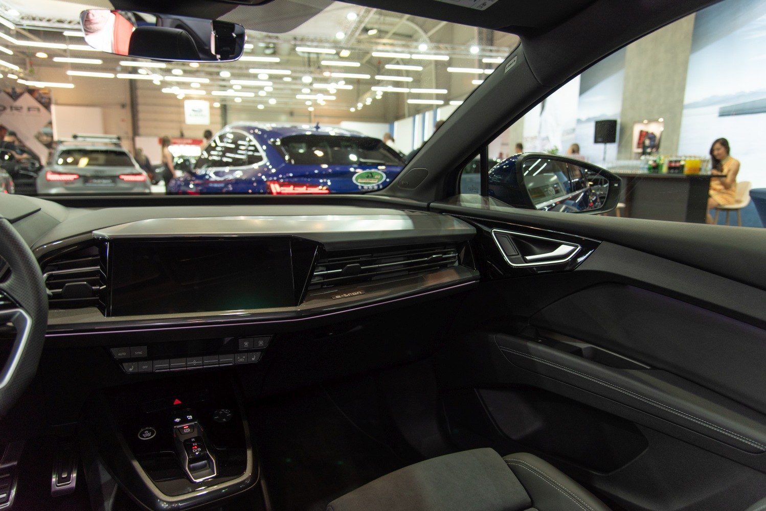 Digital dashboard and electronic gear selector in a modern electric SUV interior