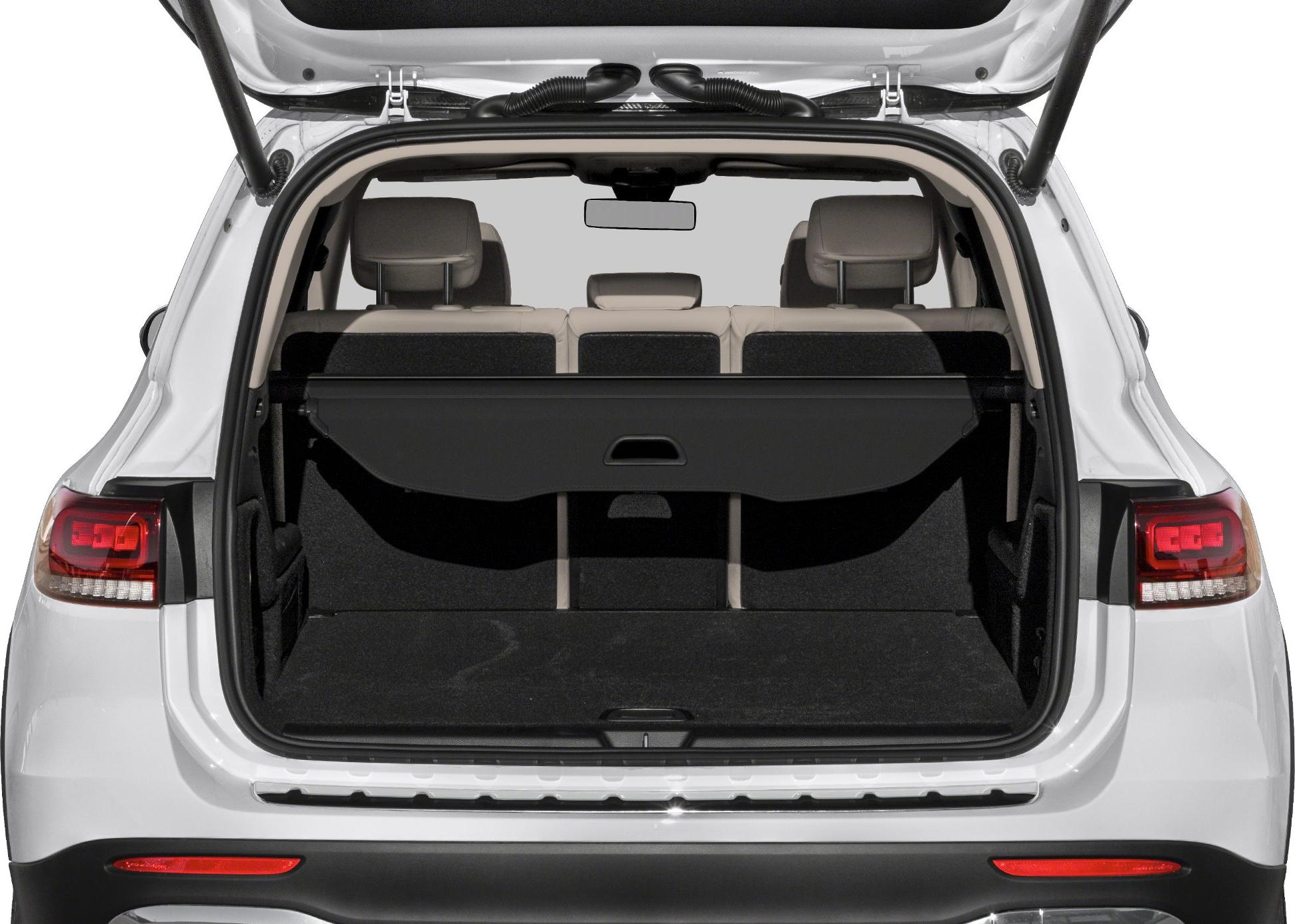 Open trunk with rear seats and cargo cover in SUV.
