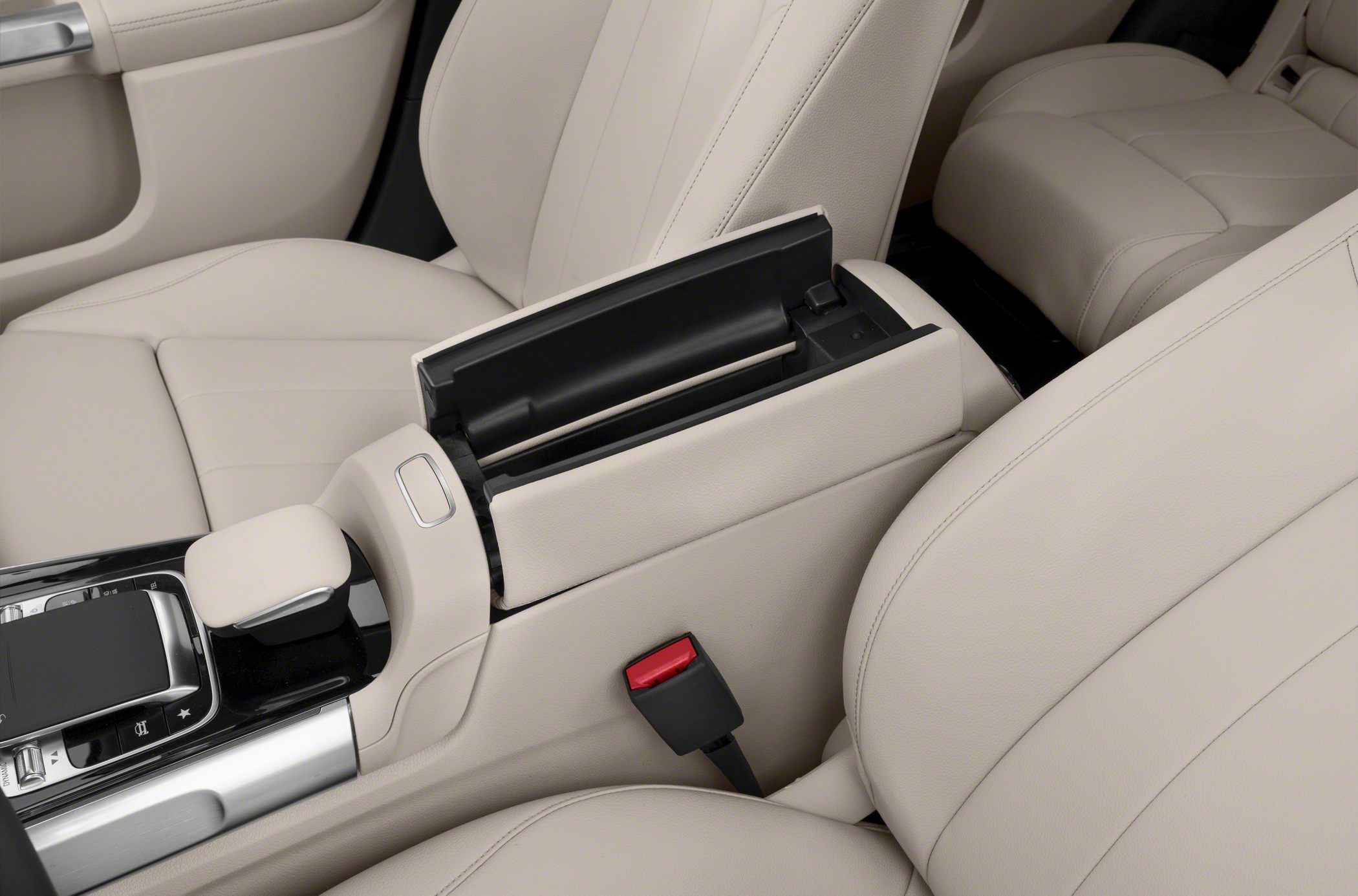 Beige leather seats with center console storage and armrest