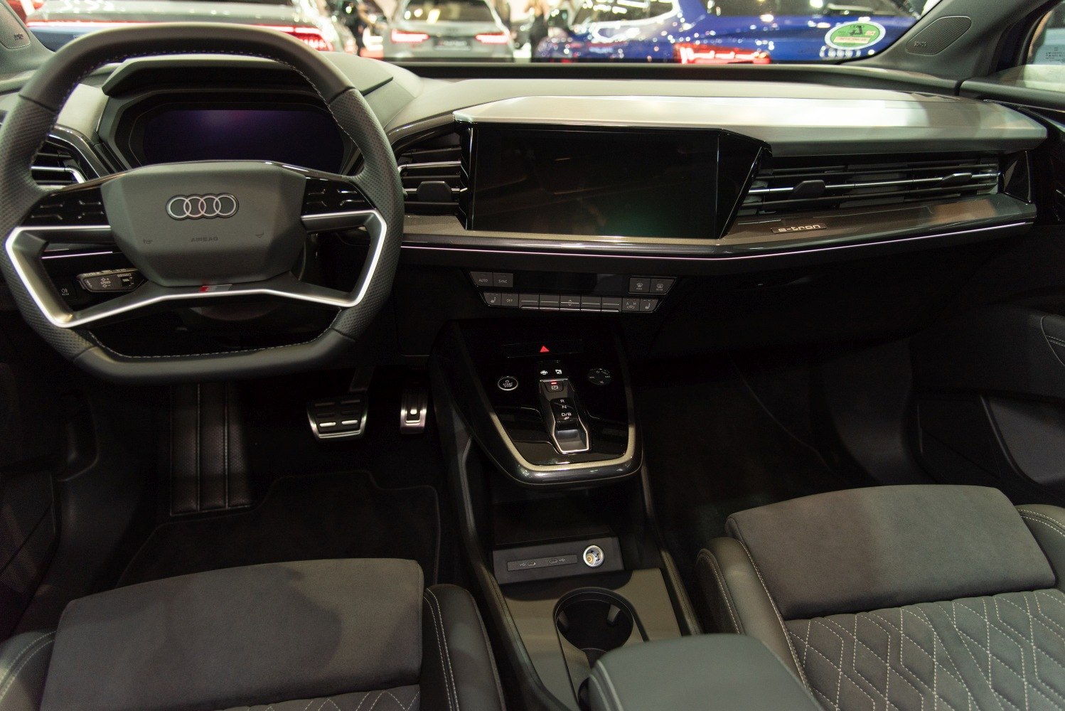 Digital dashboard and touchscreen console with unique steering wheel design
