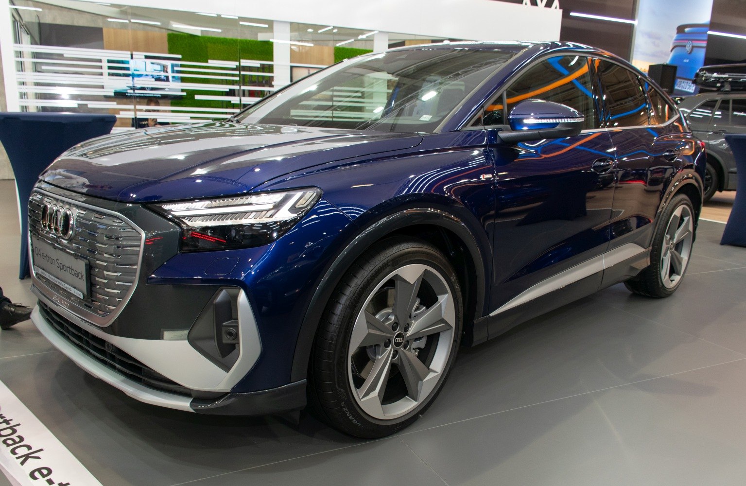 Electric crossover with prominent front grille and stylish alloy wheels