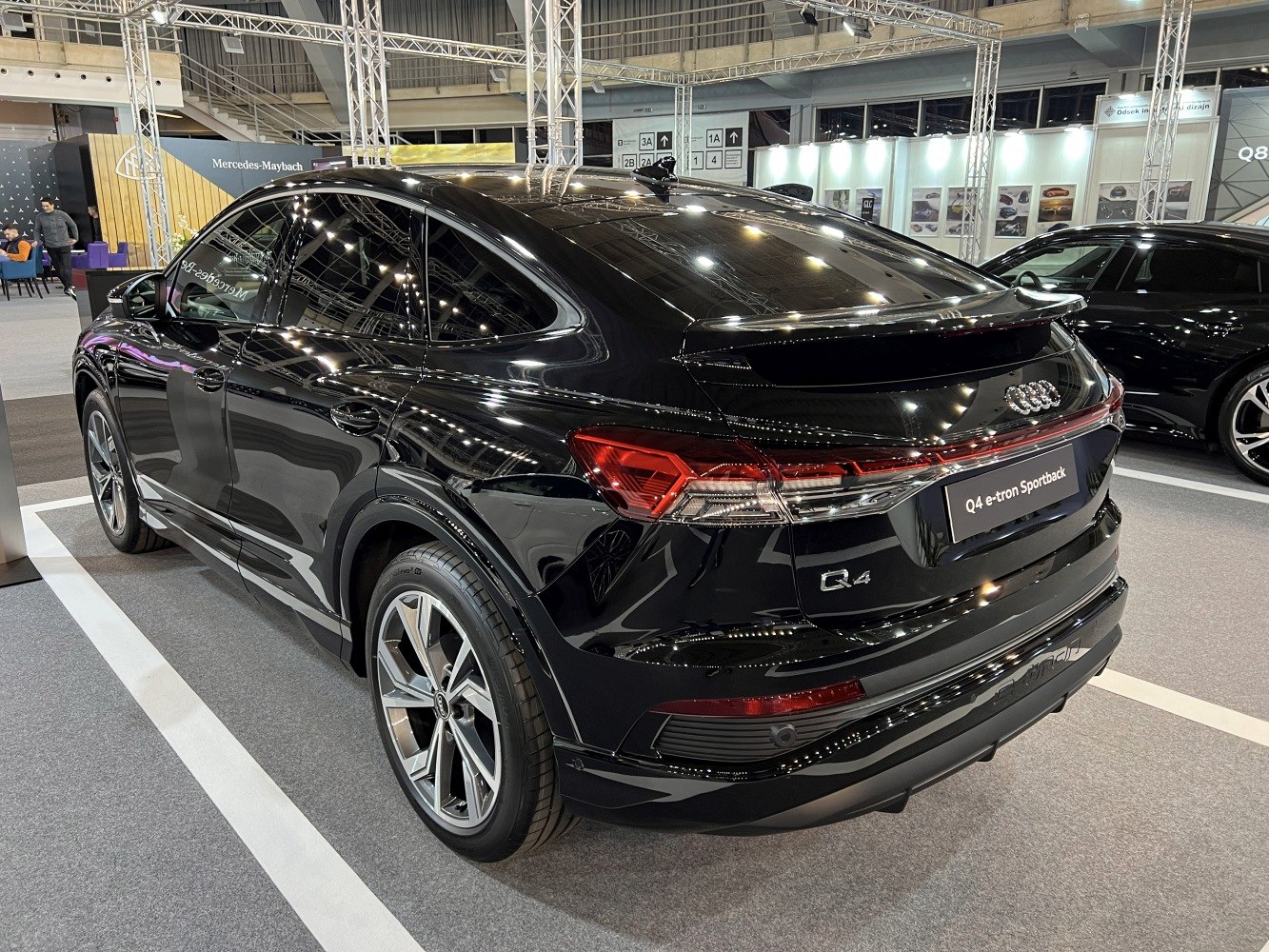 Rear and side view with distinctive taillights and sporty roofline