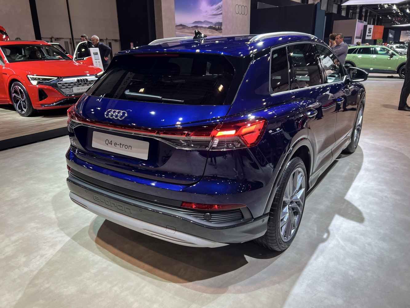 Rear electric SUV with continuous LED light strip and alloy wheels