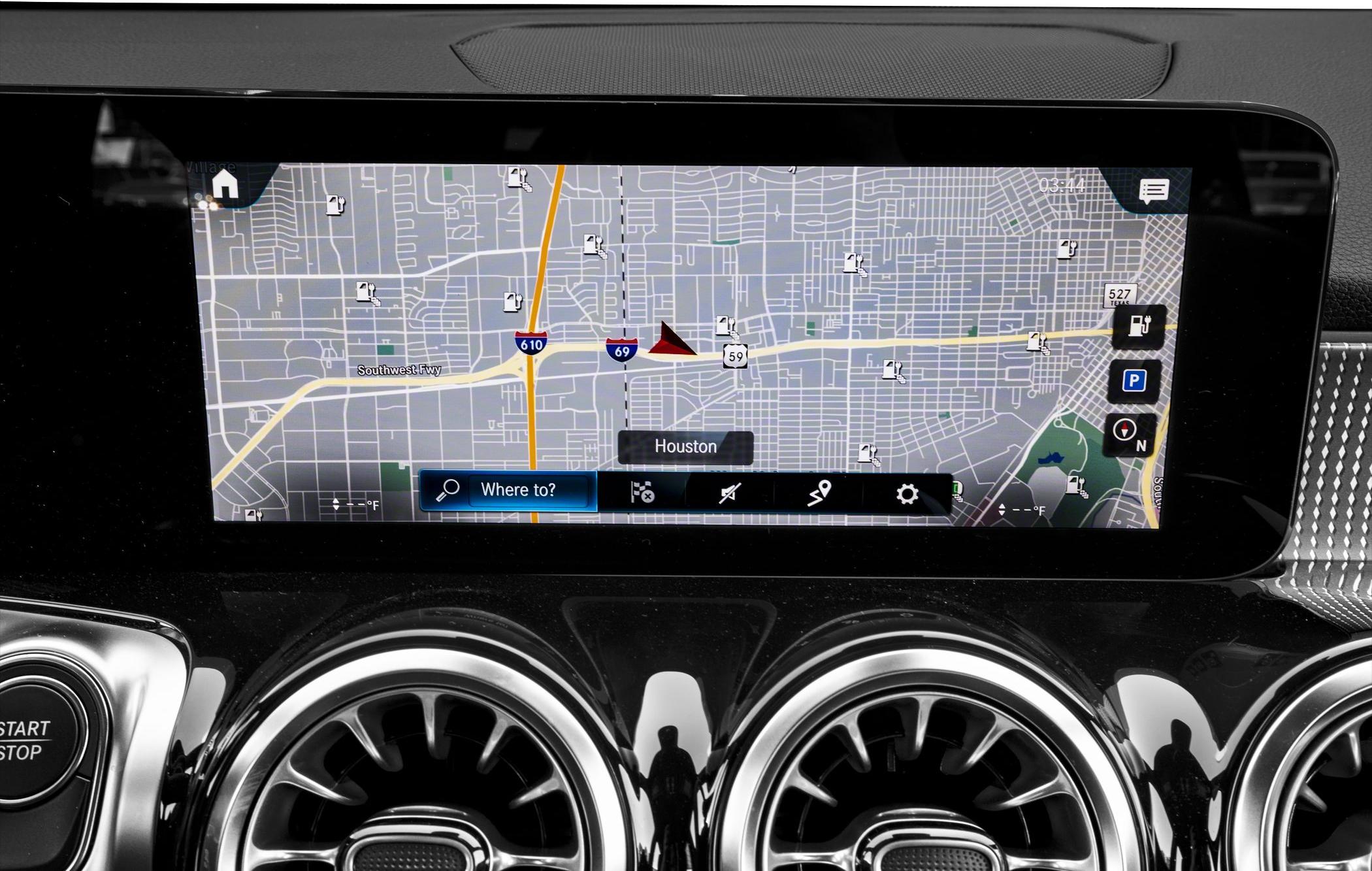 Digital navigation screen with detailed city map and control icons