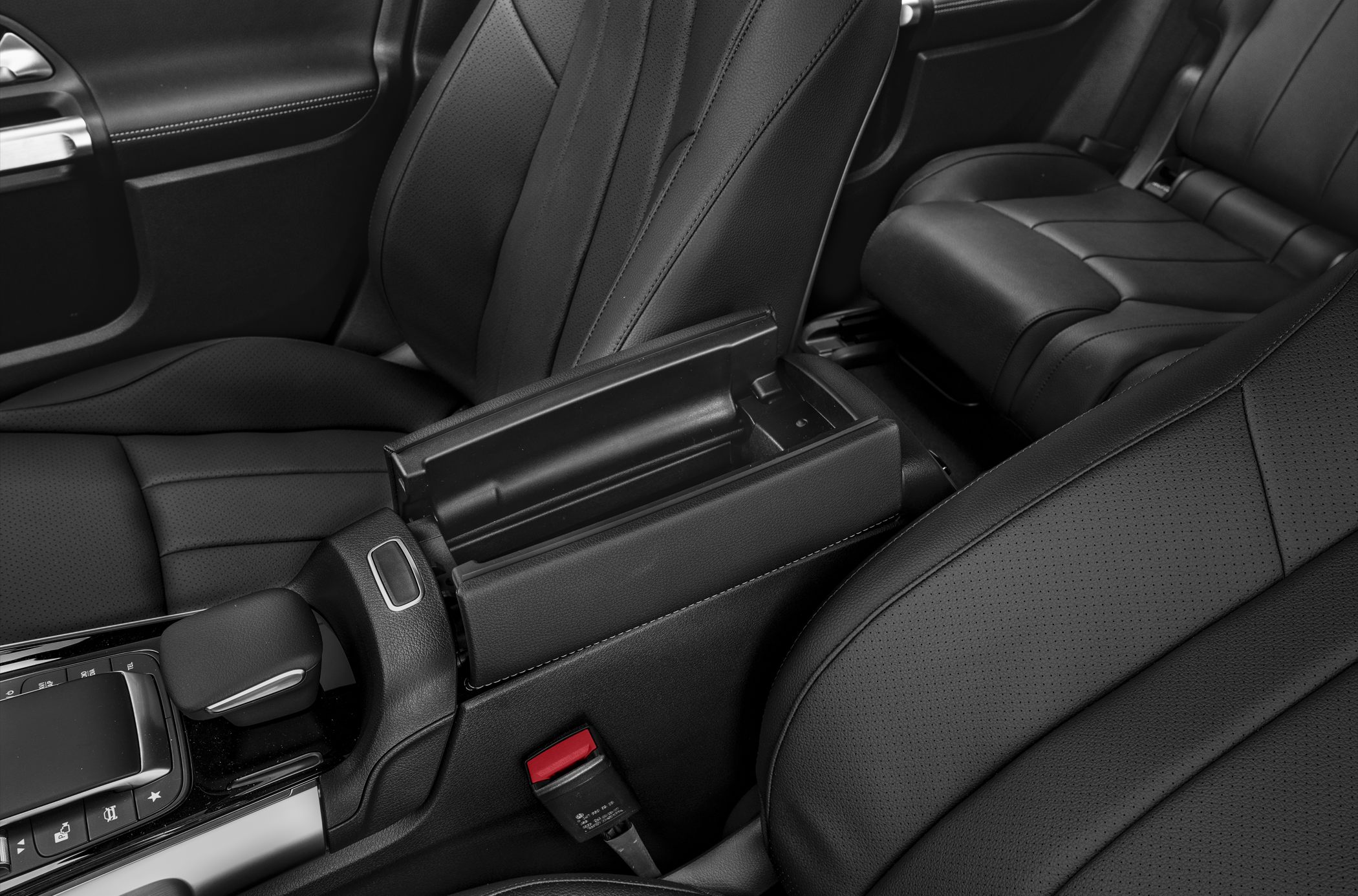 Black leather seats and open center armrest compartment