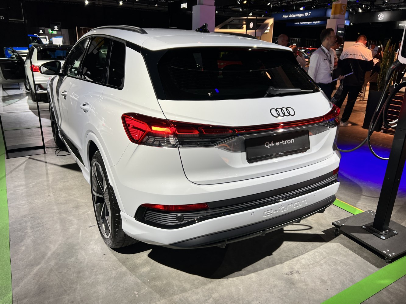 Rear view of electric SUV at charging station with LED tail lights