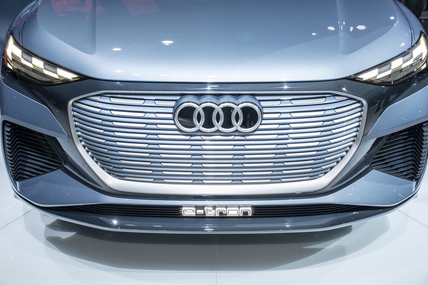 Front grille and LED headlights of modern electric vehicle