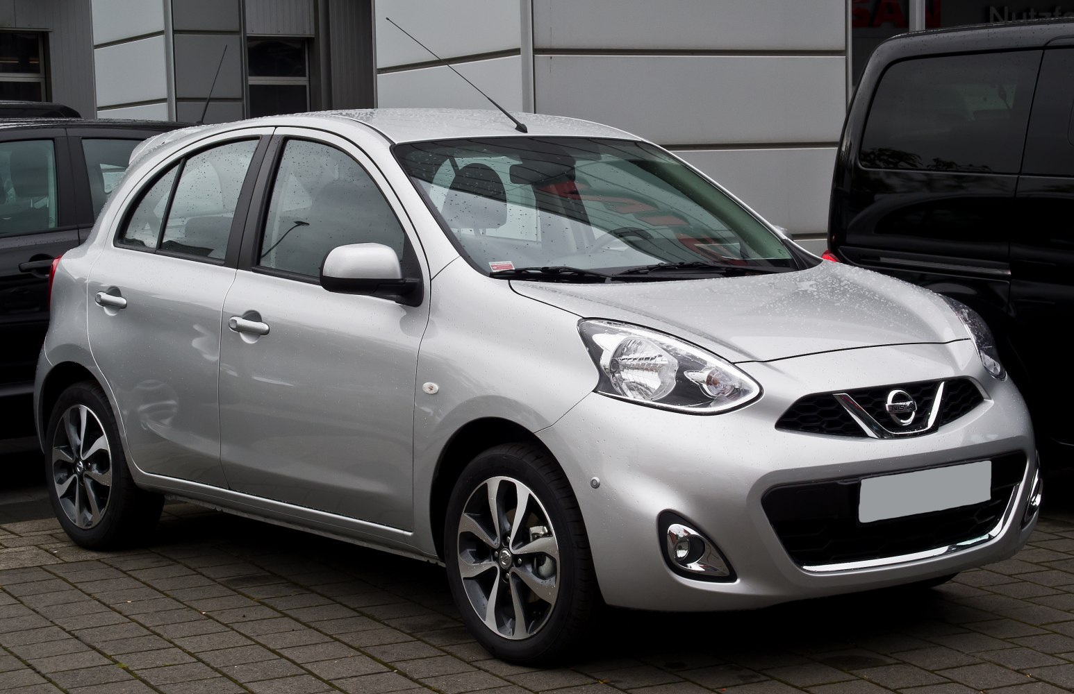 Silver hatchback car with alloy wheels and modern headlights