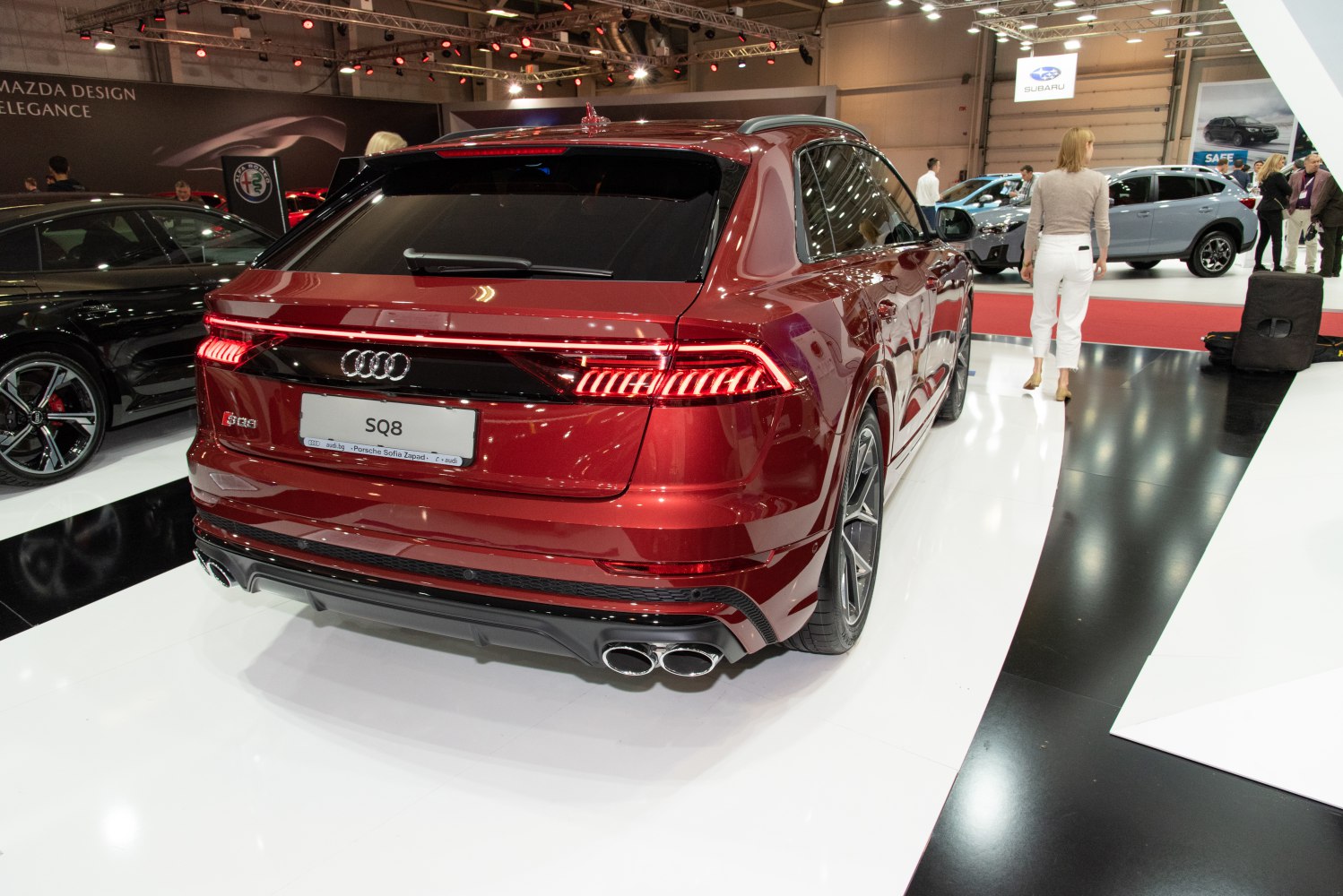 Rear LED tail lights and quad exhaust tips on a sporty luxury SUV