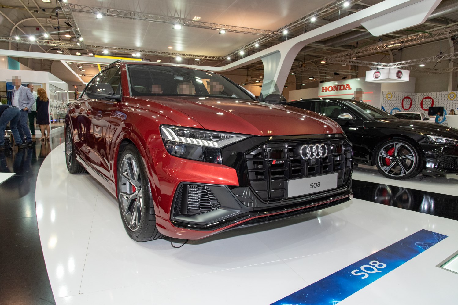 Front view with signature LED headlights and aggressive black grille