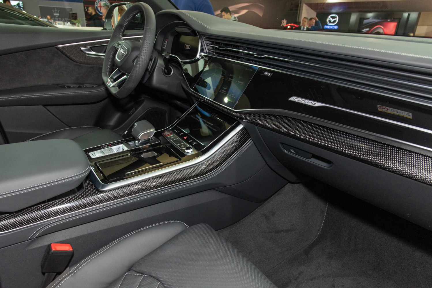 Luxury car interior with modern dashboard and carbon fiber trim