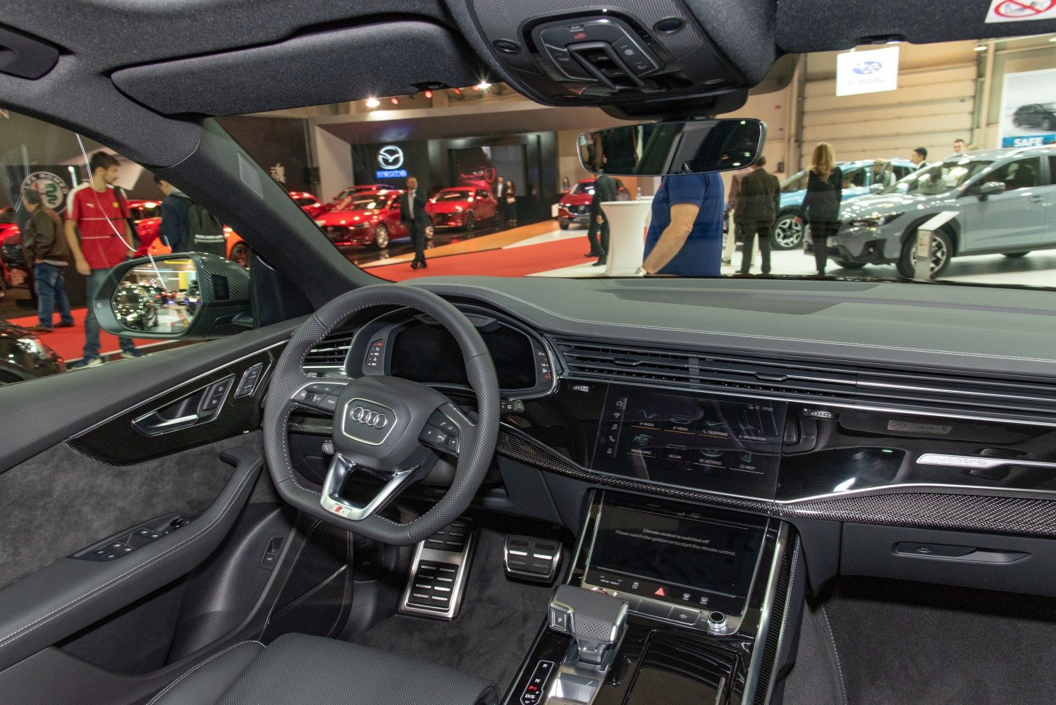 Luxury interior with digital cockpit and multifunction steering wheel.