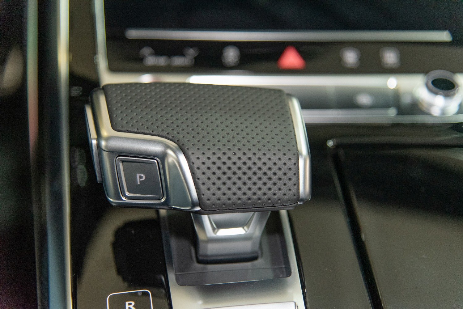 Perforated leather gear selector with park button