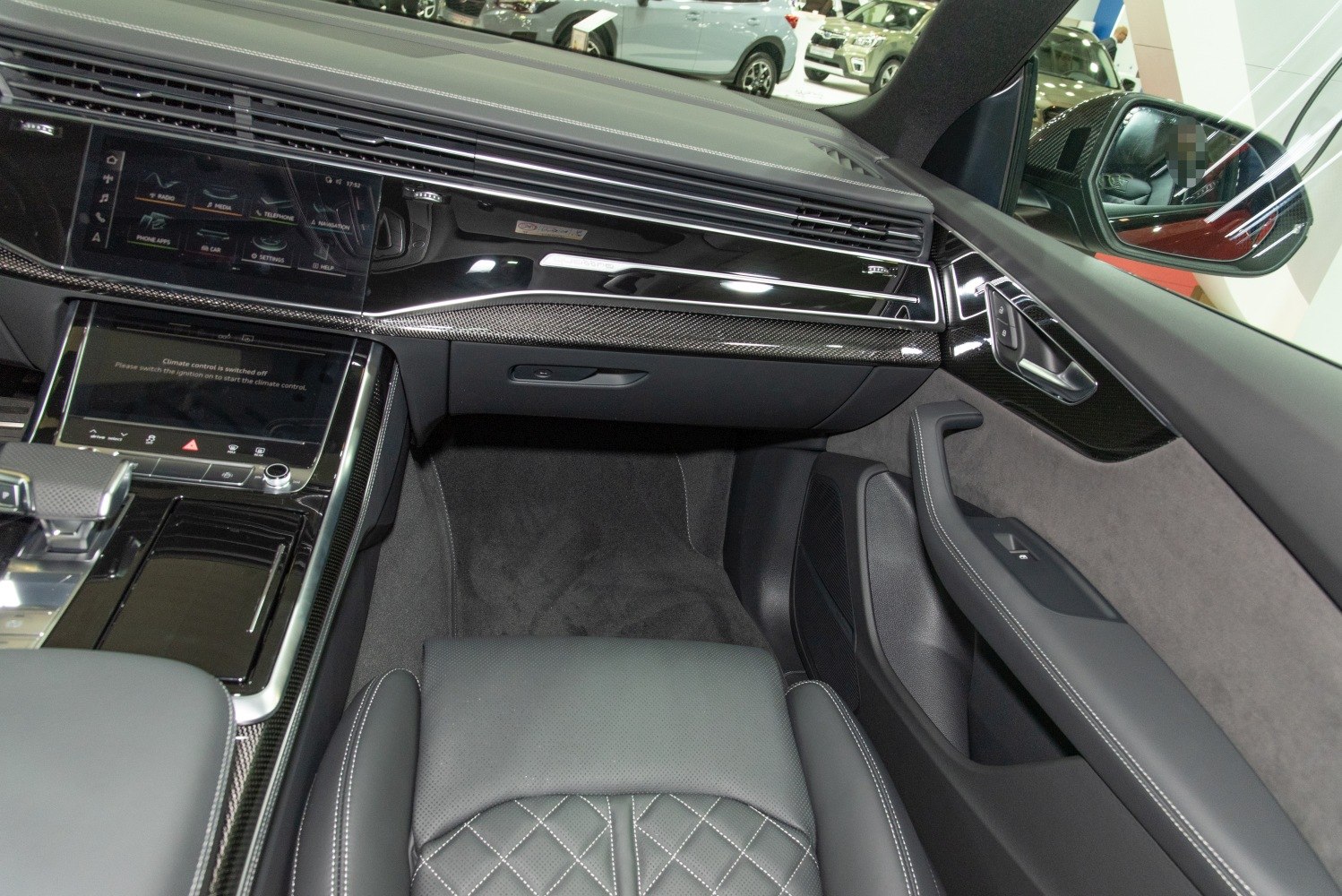Premium leather seats with diamond stitching and dual touchscreen infotainment system.
