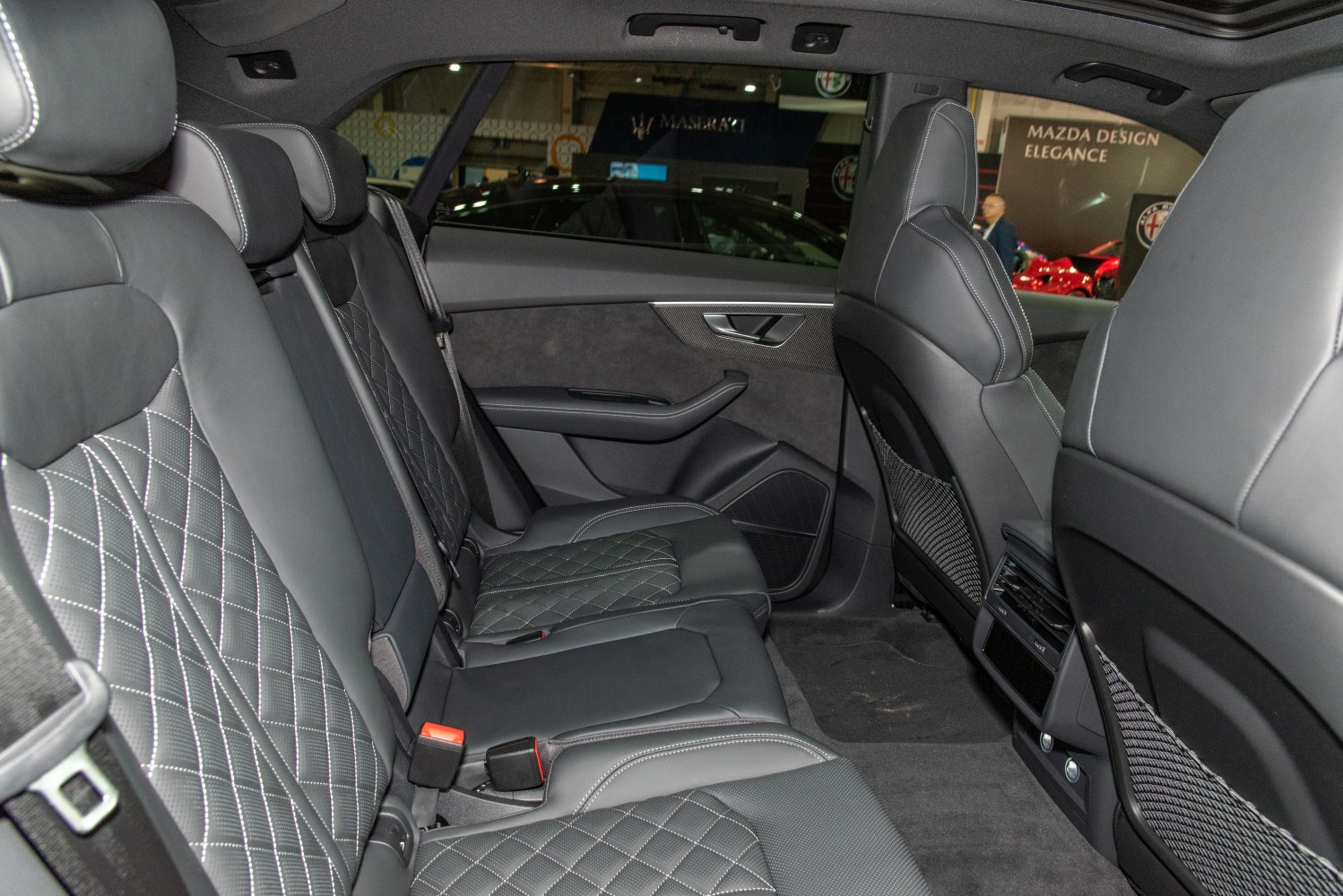 Quilted leather rear seats with spacious interior and detailed stitching.