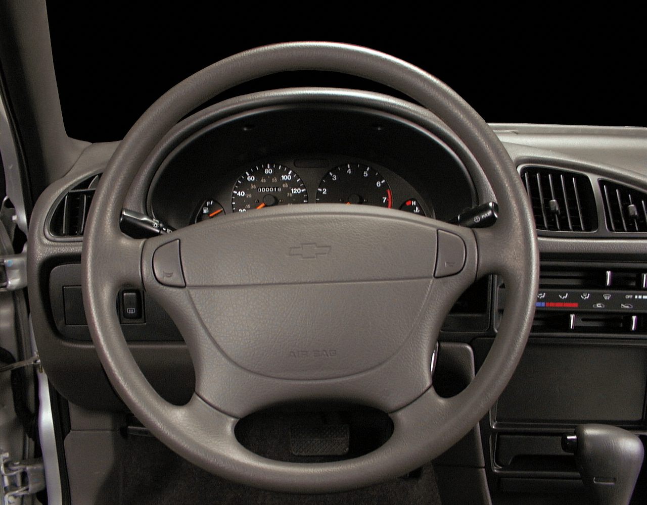 Dashboard and steering wheel with instrument cluster and climate controls