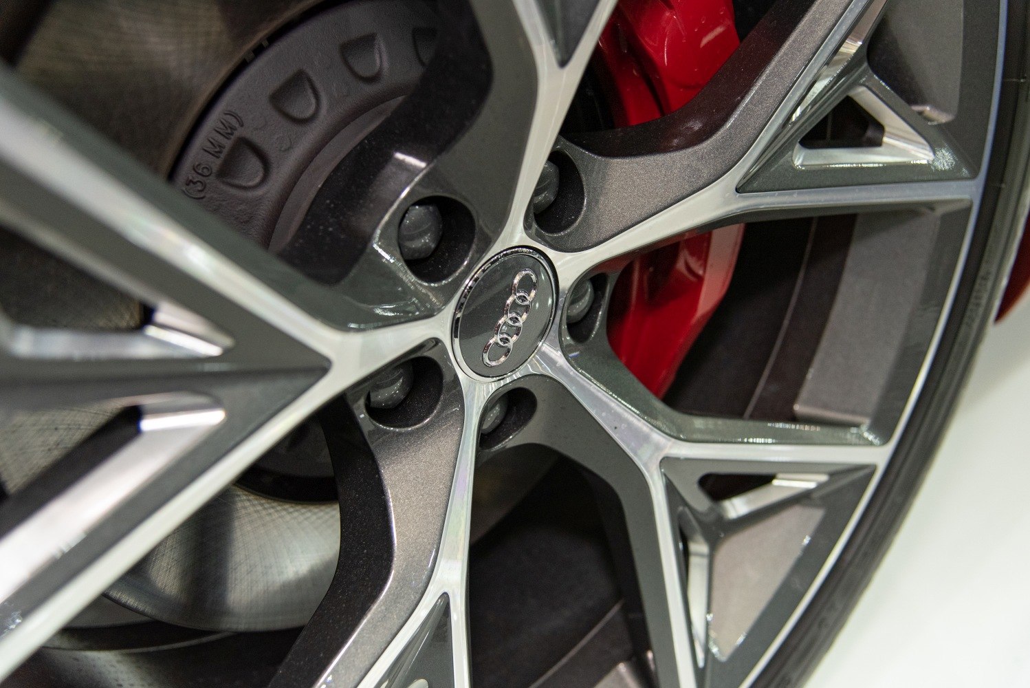Close-up of alloy wheel and red brake caliper