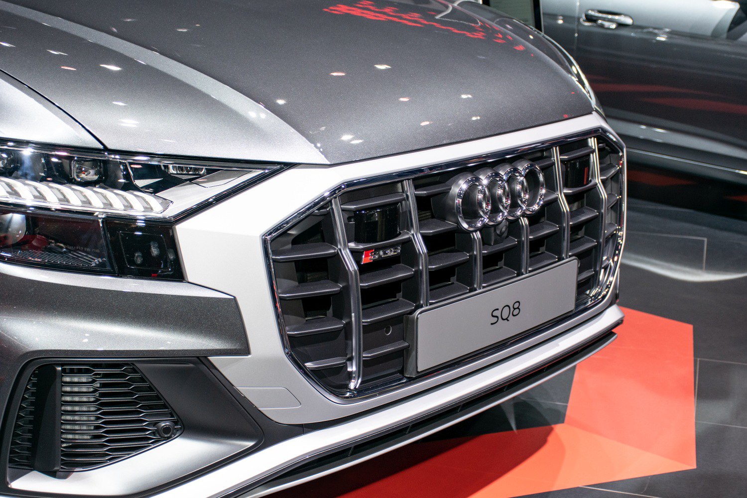 Close-up of front grille and headlight with distinctive design elements