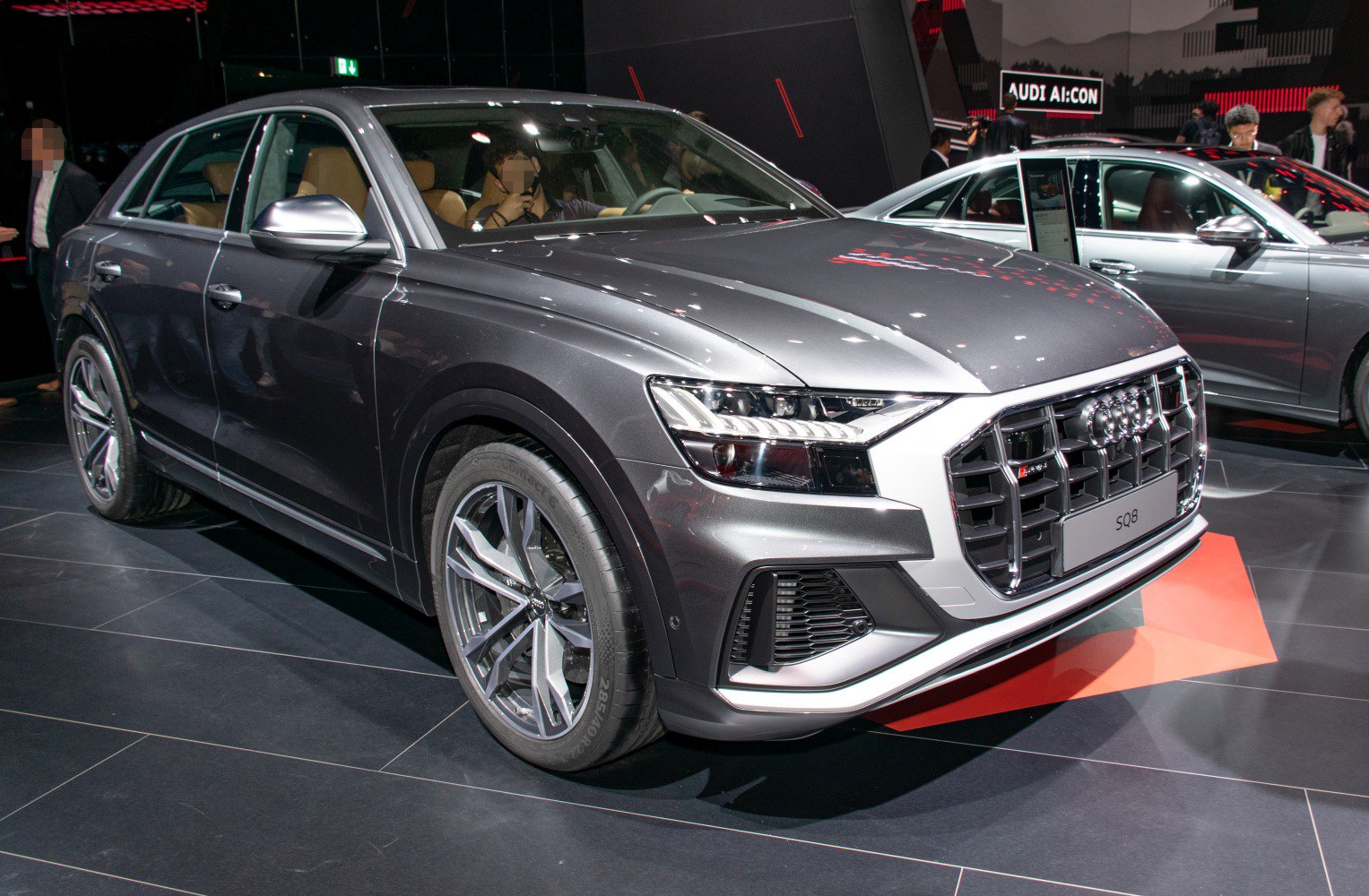 Front view of SUV with prominent grille, LED headlights, and alloy wheels