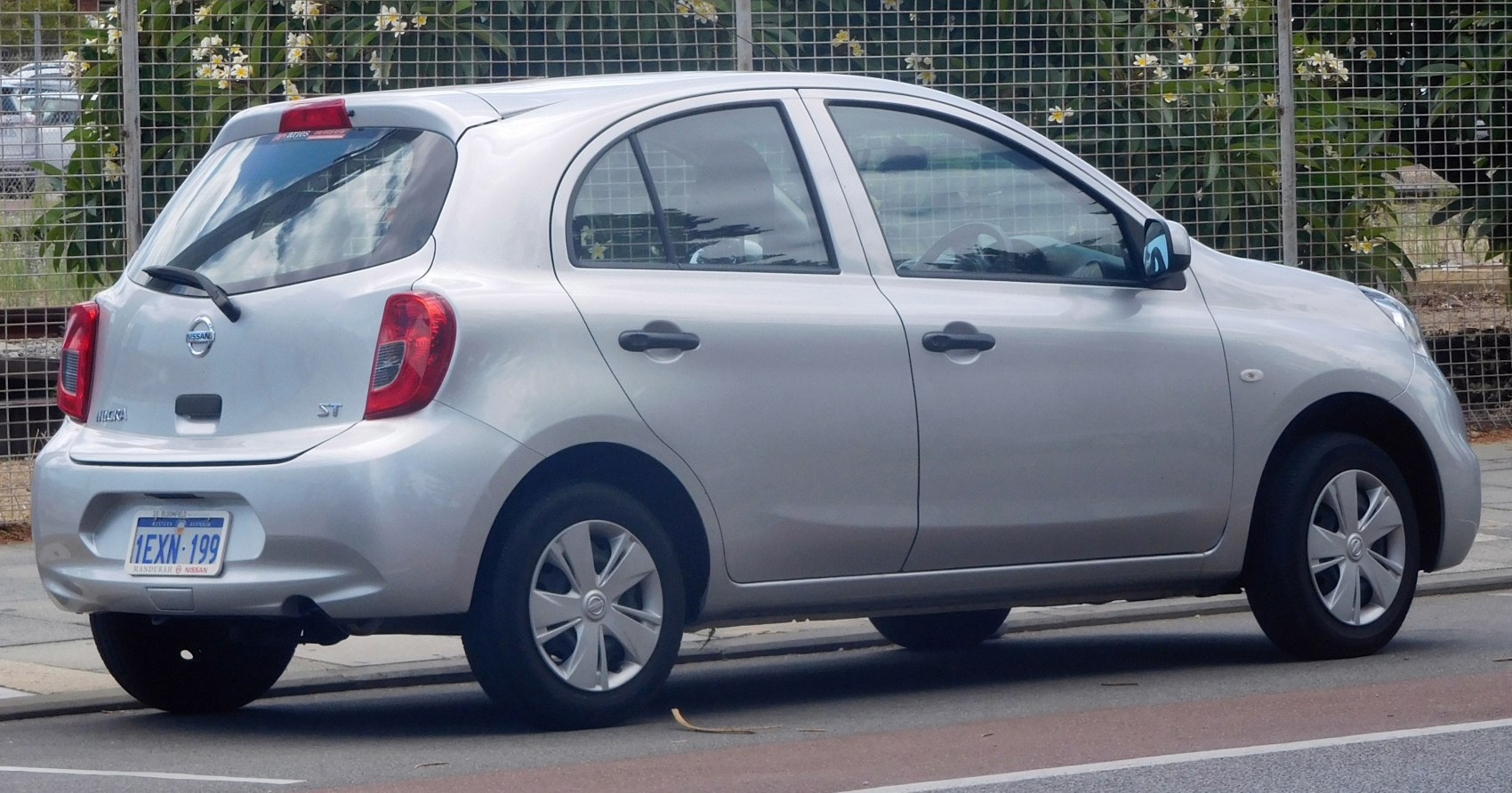 Rear side view of a silver five-door hatchback with compact design