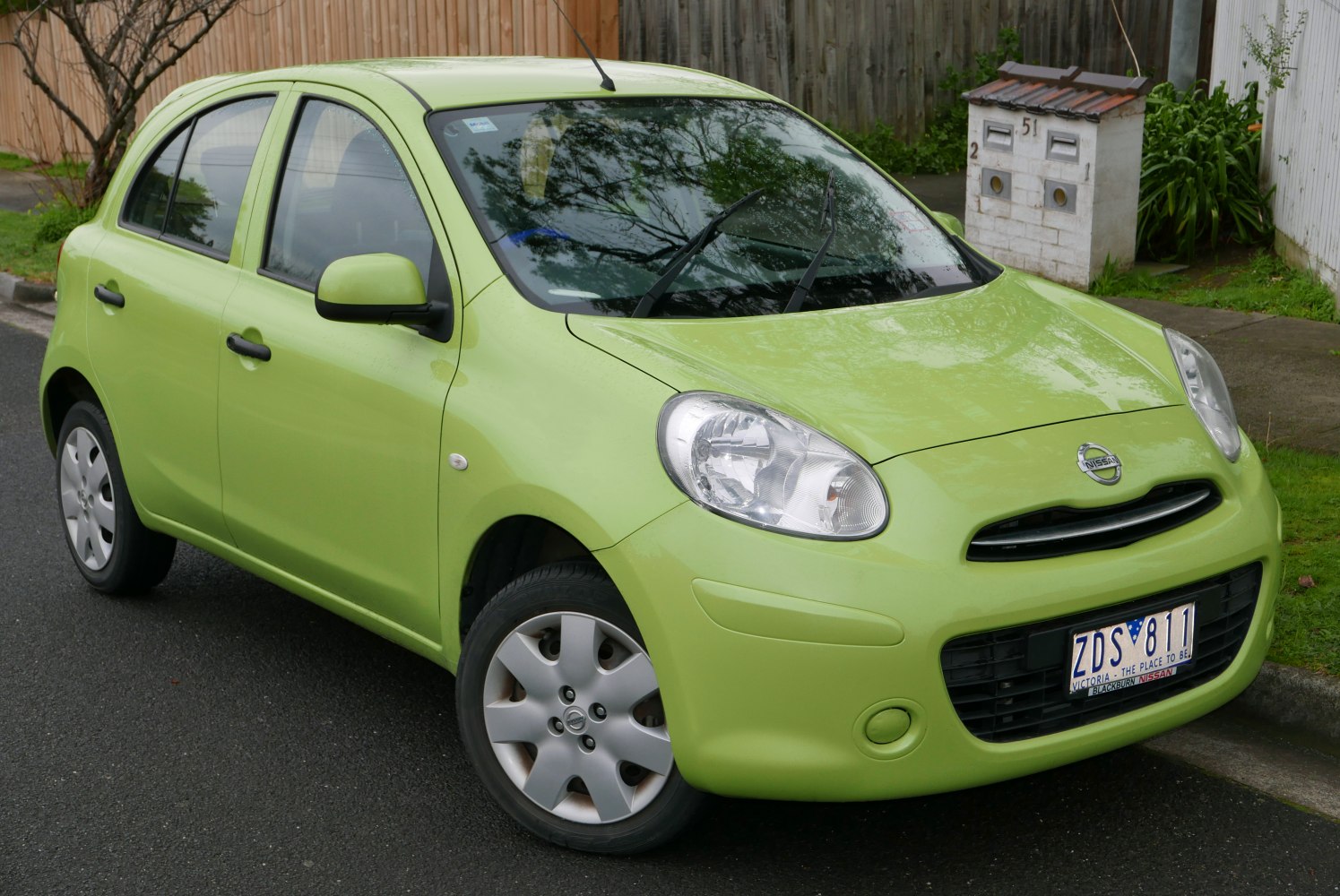 Compact hatchback with rounded headlights and smooth body lines