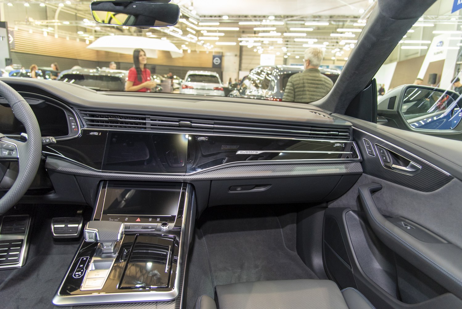 Modern luxury SUV interior with digital dashboard and advanced center console