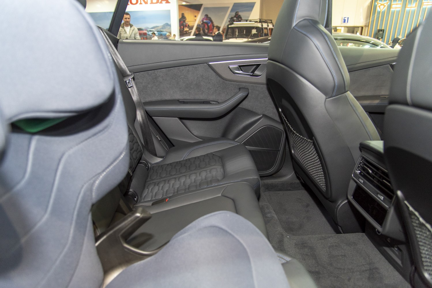 Detailed rear seat interior with premium upholstery and rear air vents