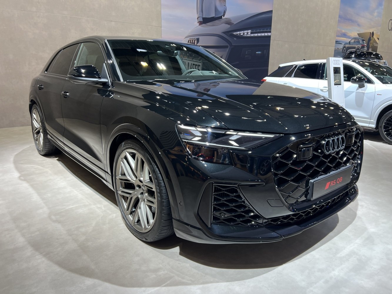 Aggressive front grille with LED headlights on a 2025 luxury SUV.