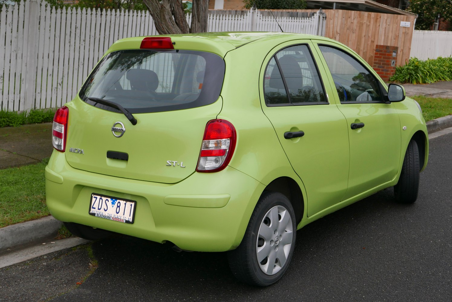 Compact hatchback rear with taillights and rear windshield wiper