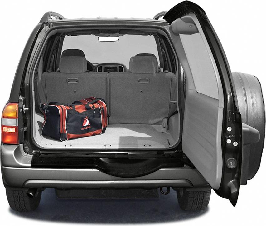 Rear cargo space with open rear door and duffel bag inside