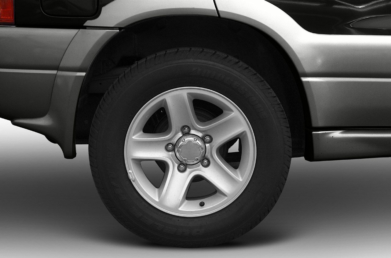 Alloy wheel and Bridgestone tire close-up on SUV