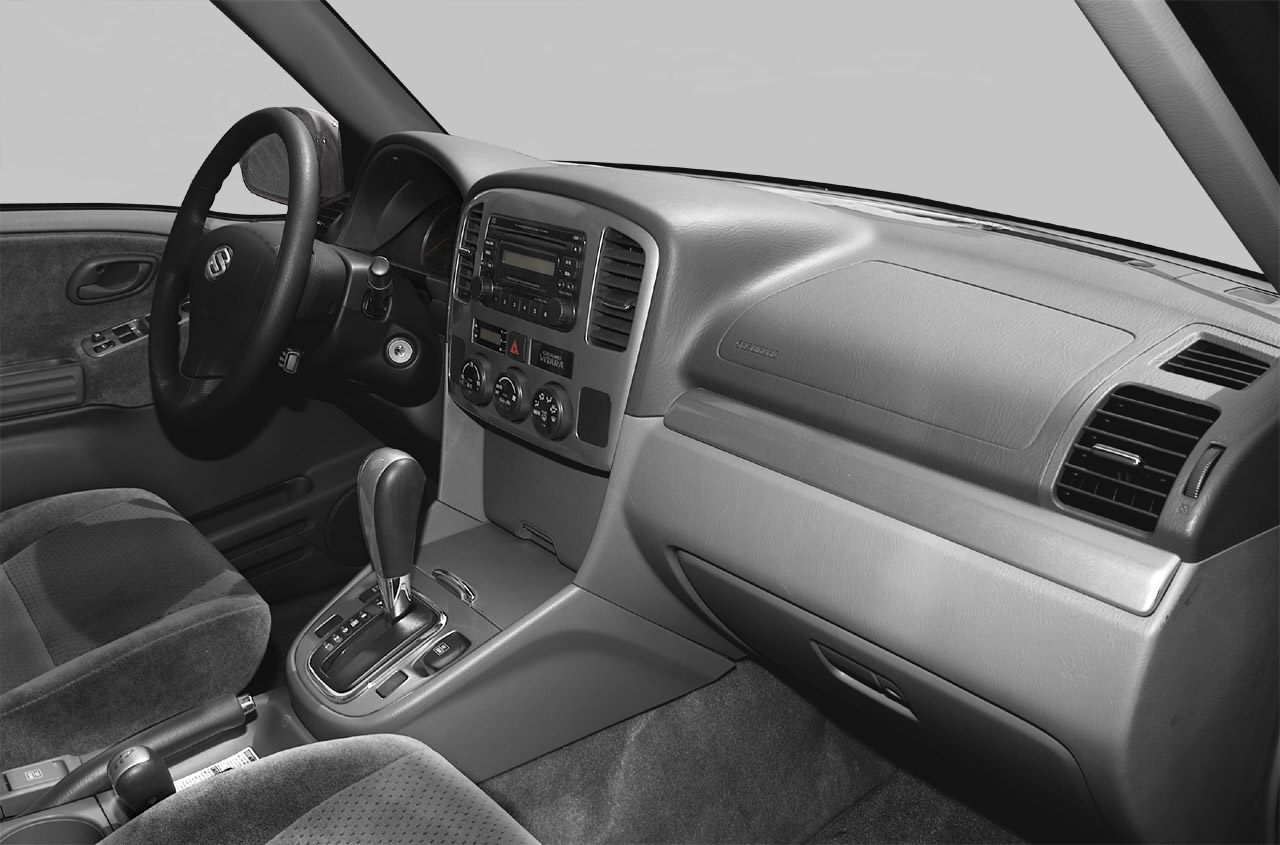 Dashboard and center console layout with steering wheel and gear shift.