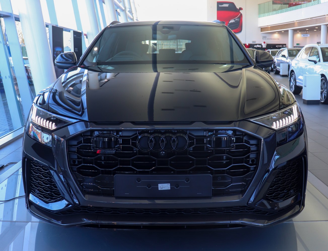 Front view with black honeycomb grille and LED headlights