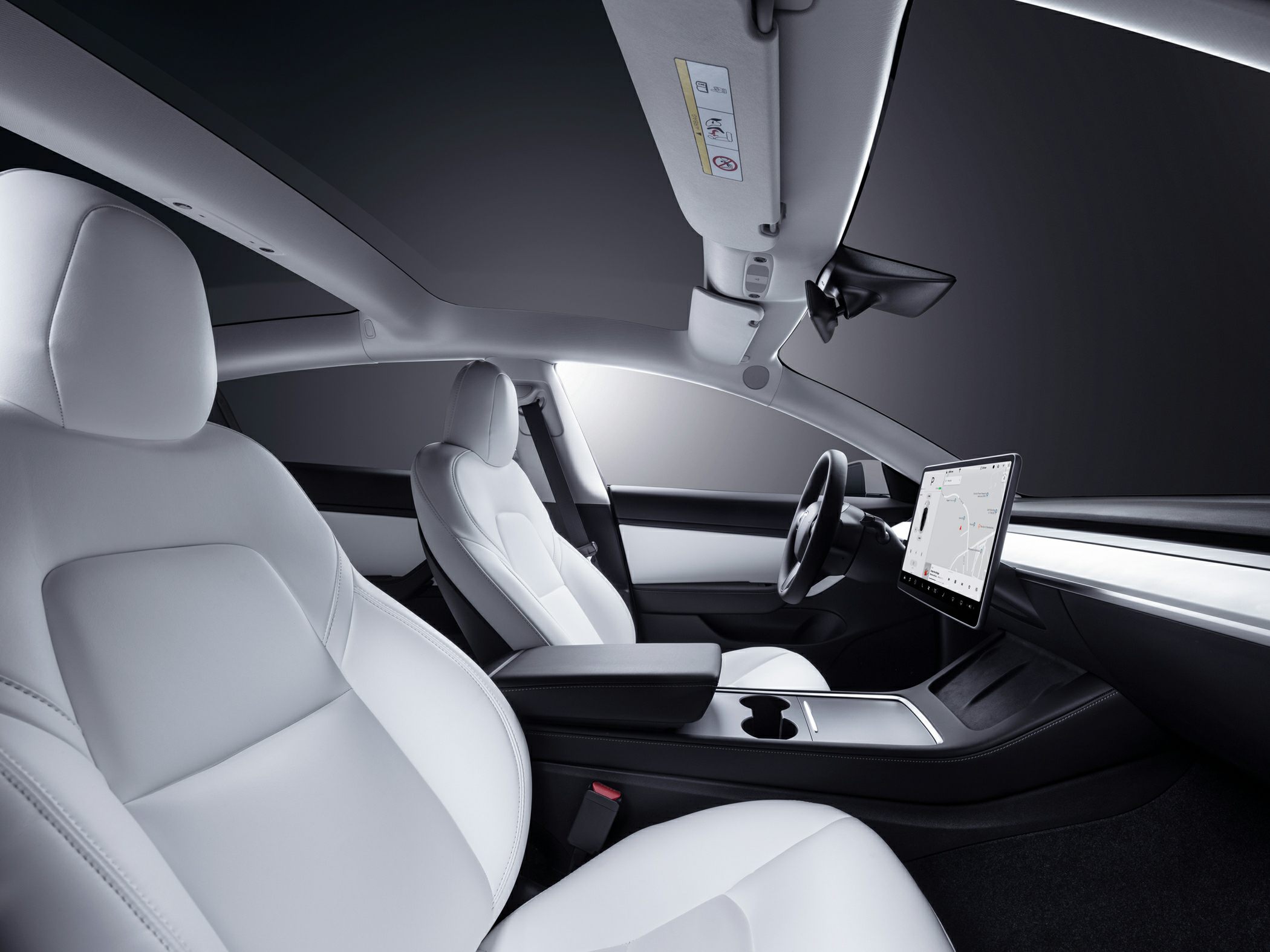 White seats and panoramic roof with central touchscreen